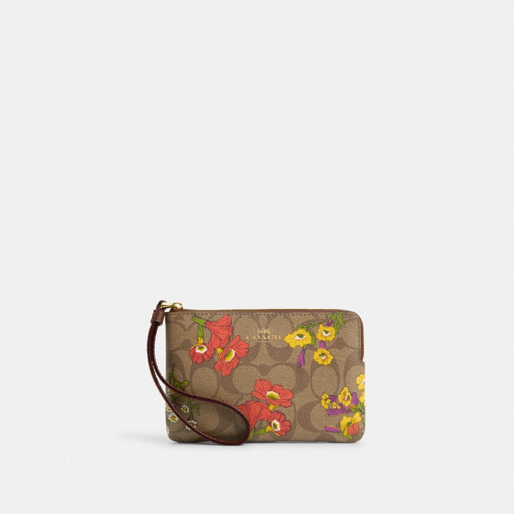 COACH®,CORNER ZIP WRISTLET IN SIGNATURE CANVAS WITH FLORAL PRINT,Signature Canvas,Gold/Khaki Multi,Front View image number 0