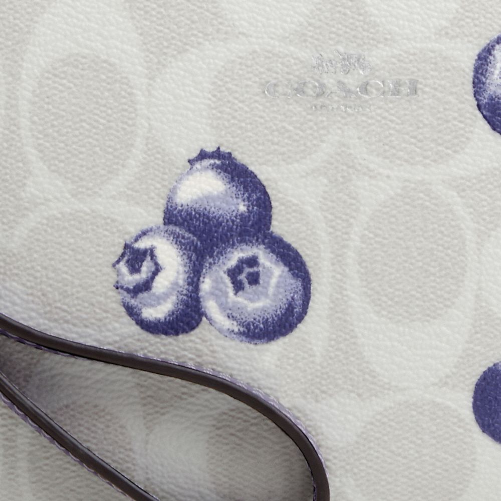 COACH®,CORNER ZIP WRISTLET IN SIGNATURE CANVAS WITH BLUEBERRY PRINT,Signature Canvas,Mini,Silver/Chalk/Light Violet