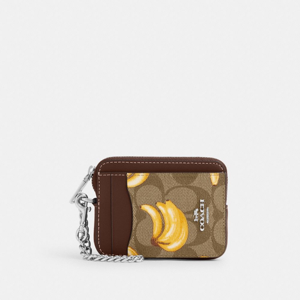 COACH®,ZIP CARD CASE IN SIGNATURE CANVAS WITH BANANA PRINT,Signature Canvas,Mini,Silver/Khaki/Dark Saddle,Front View