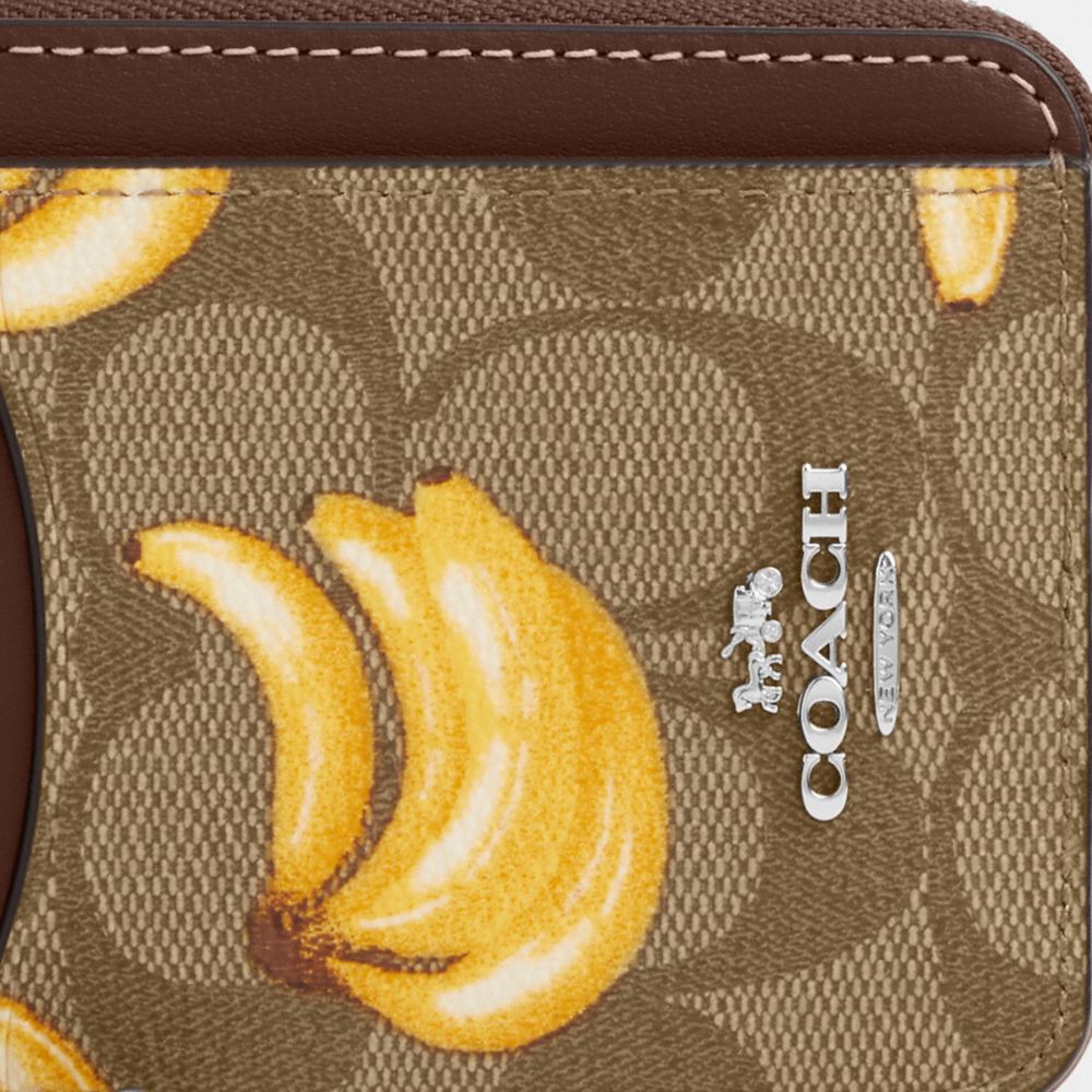 COACH®,ZIP CARD CASE IN SIGNATURE CANVAS WITH BANANA PRINT,Signature Canvas,Mini,Silver/Khaki/Dark Saddle