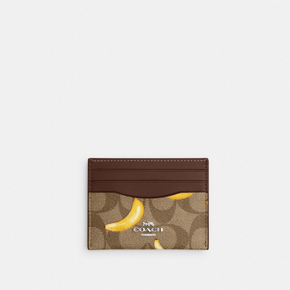 COACH®,SLIM ID CARD CASE IN SIGNATURE CANVAS WITH BANANA PRINT,Signature Canvas,Silver/Khaki/Dark Saddle,Front View image number 0