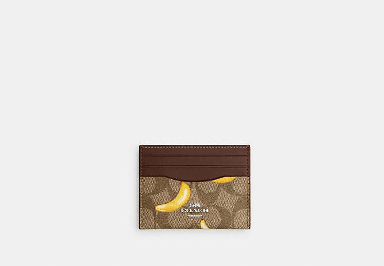 COACH®,SLIM ID CARD CASE IN SIGNATURE CANVAS WITH BANANA PRINT,pvc,Silver/Khaki/Dark Saddle,Front View image number 0