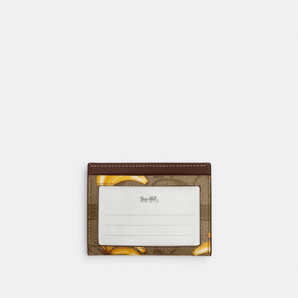 COACH®,SLIM ID CARD CASE IN SIGNATURE CANVAS WITH BANANA PRINT,Signature Canvas,Silver/Khaki/Dark Saddle,Back View