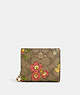 COACH®,SNAP WALLET IN SIGNATURE CANVAS WITH FLORAL PRINT,pvc,Mini,Gold/Khaki Multi,Front View