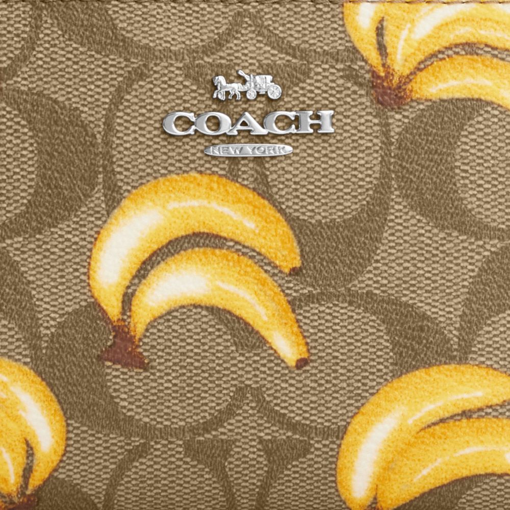 COACH®,SNAP WALLET IN SIGNATURE CANVAS WITH BANANA PRINT,Signature Canvas,Mini,Silver/Khaki/Dark Saddle