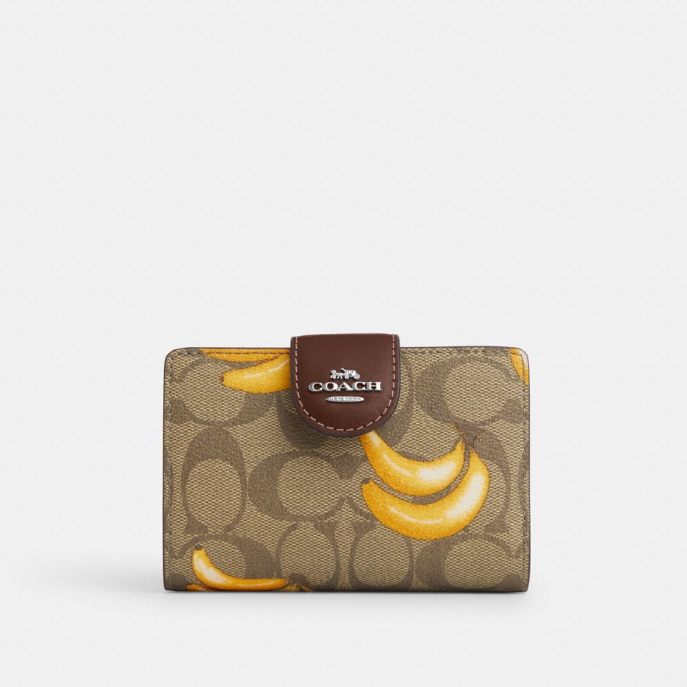 Shop Coach Outlet Medium Corner Zip Wallet In Signature Canvas With Banana Print In Brown