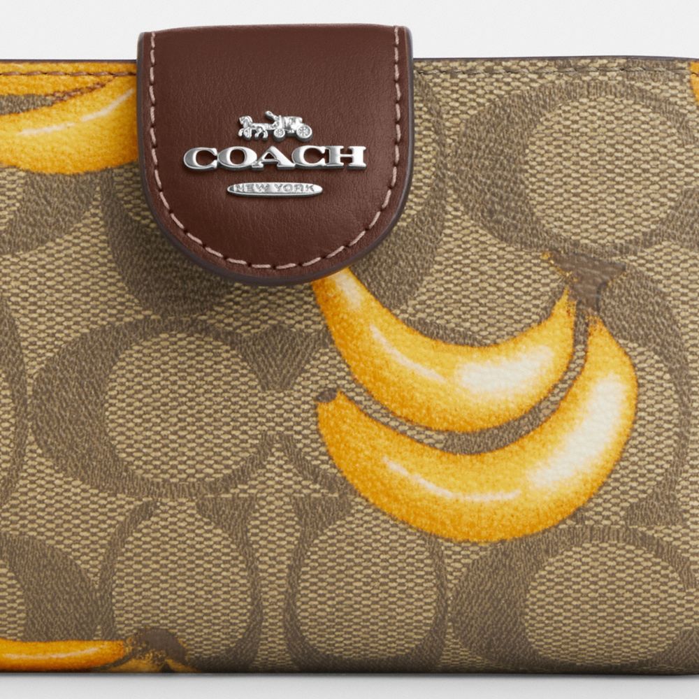 COACH®,MEDIUM CORNER ZIP WALLET IN SIGNATURE CANVAS WITH BANANA PRINT,Signature Canvas,Mini,Silver/Khaki/Dark Saddle