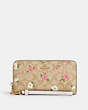 COACH®,LONG ZIP AROUND WALLET IN SIGNATURE CANVAS WITH FLORAL PRINT,pvc,Mini,Gold/Light Khaki Chalk Multi,Front View