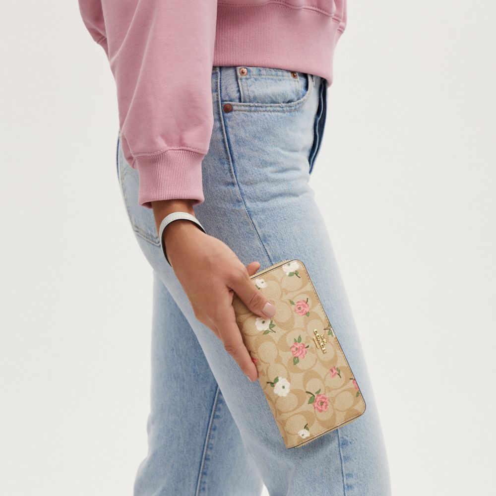 COACH®,LONG ZIP AROUND WALLET IN SIGNATURE CANVAS WITH FLORAL PRINT,Signature Canvas,Mini,Gold/Light Khaki Chalk Multi,Detail View