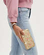 COACH®,LONG ZIP AROUND WALLET IN SIGNATURE CANVAS WITH FLORAL PRINT,pvc,Mini,Gold/Light Khaki Chalk Multi,Detail View