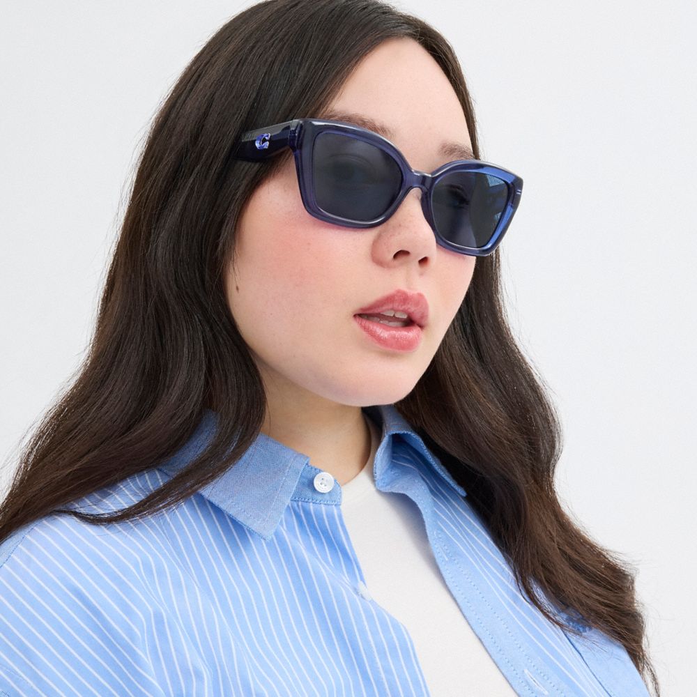 COACH®,JELLY TABBY SQUARE CAT EYE SUNGLASSES,Transparent Blue,Angle View