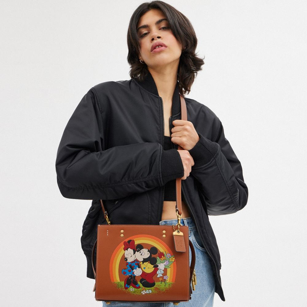 Coach Disney X  Rogue Bag 25 With Mickey Mouse And Minnie Mouse In Brass/burnished Amber Multi