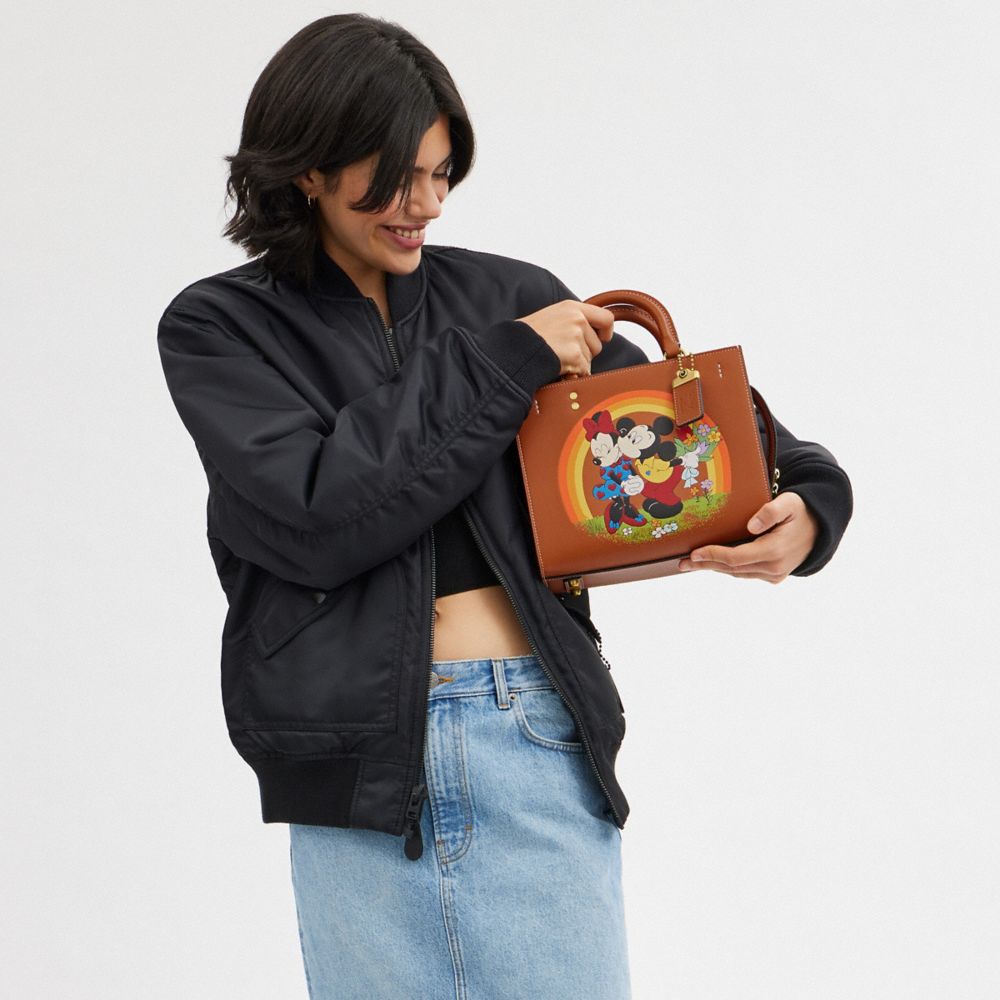 Coach Disney X  Rogue Bag 25 With Mickey Mouse And Minnie Mouse In Brass/burnished Amber Multi