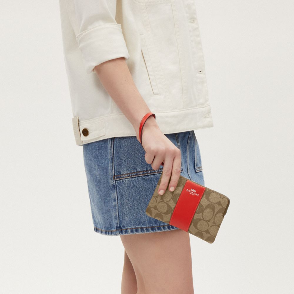 COACH®,CORNER ZIP WRISTLET IN SIGNATURE CANVAS,Signature Canvas,Silver/Khaki/Miami Red,Detail View