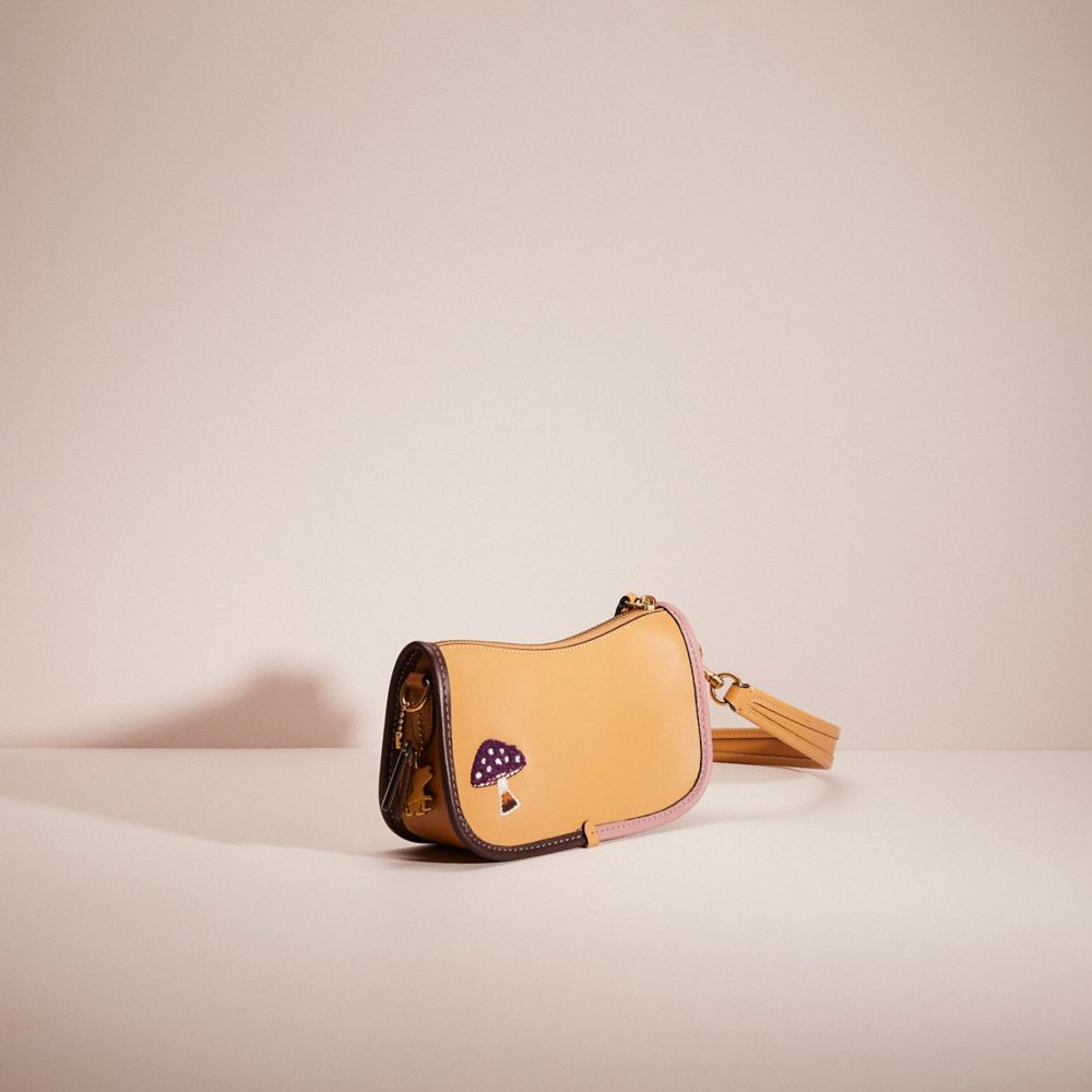 COACH®,UPCRAFTED SWINGER 20 WITH CREATURE PATCHES,Brass/Light Tan Multi,Angle View
