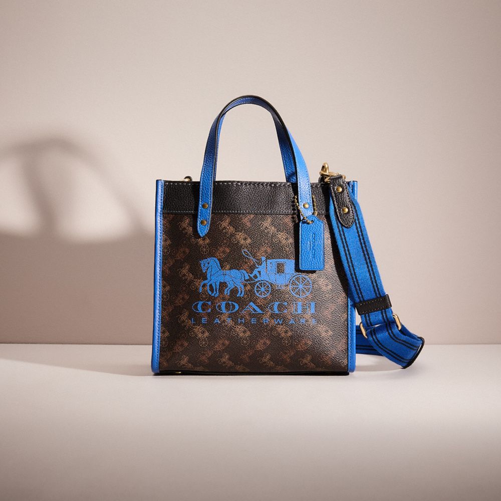 COACH®,RESTORED FIELD TOTE 22 WITH HORSE AND CARRIAGE PRINT AND CARRIAGE BADGE,Brass/Truffle Blue Fin,Front View
