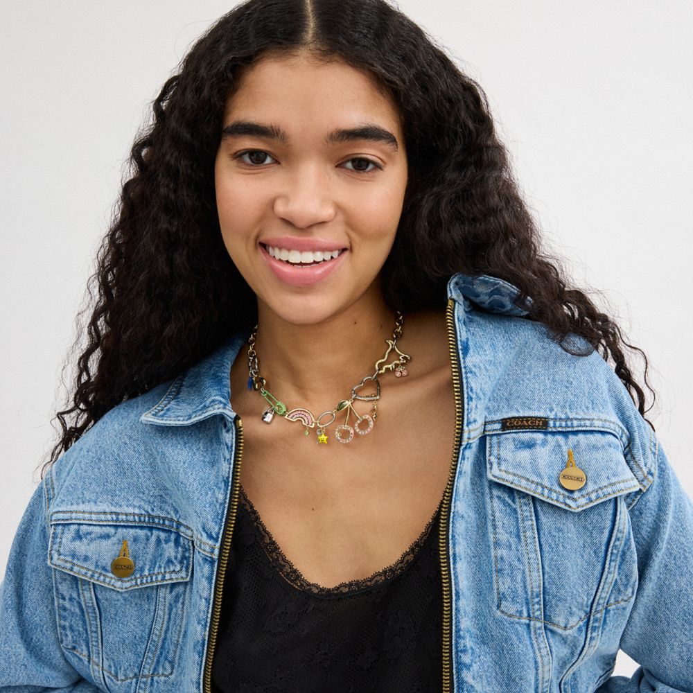 COACH®,Safety Pin Charm Necklace,Single Strand,Resin,Crystal,Glass,Enamel,Food Embellishment,Heart Embellishment,Logo,Star...,Multi Color,Detail View