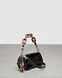 COACH®,Mini Wavy Dinky Bag With Crossbody Strap In Croc-Embossed Coachtopia Leather,Mini,Croc-Embossed,Black,Angle View