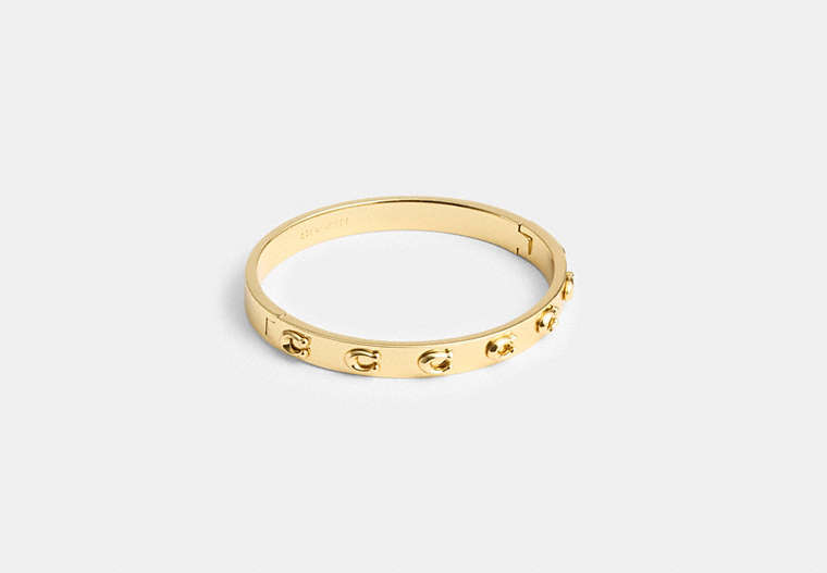 COACH®,PEGGED SIGNATURE HINGED BANGLE,Gold,Front View image number 0