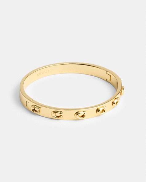 COACH®,PEGGED SIGNATURE HINGED BANGLE,Gold,Front View