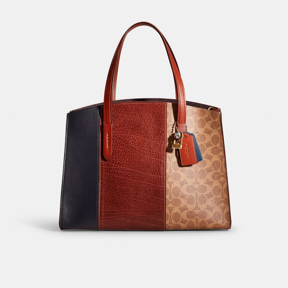 Coach charlie carryall discount signature