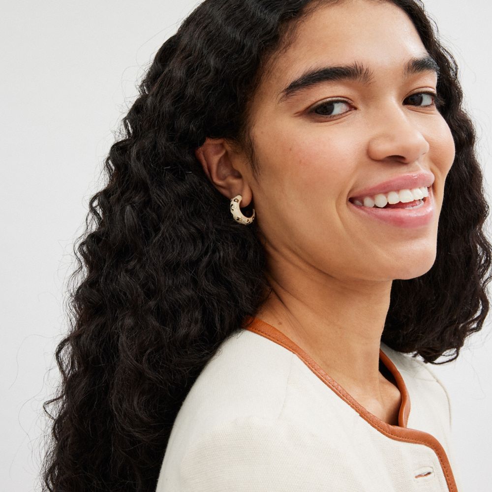 COACH®,Enamel Signature Floral Huggie Earrings,Huggies,Crystal,Glass,Cubic Zirconia,Floral Embellishment,Gem Embellishment...,Cream,Detail View