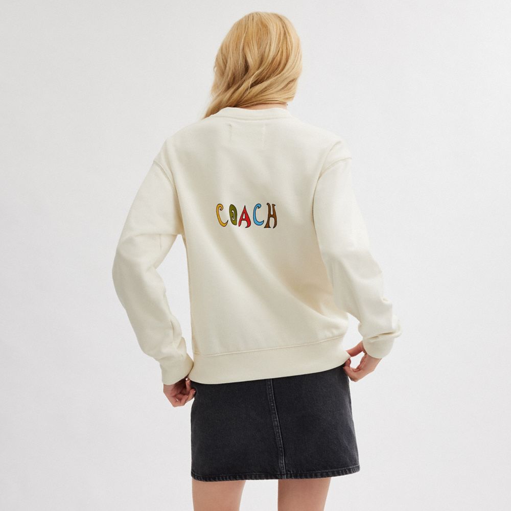 COACH®,【COACH X OBSERVED BY US】ウィンディ フラワー クルーネック,トップス&ワンピース,