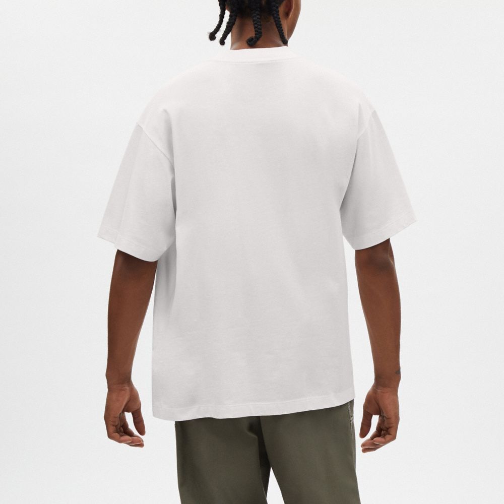 公式】COACH – コーチ | 【COACH X OBSERVED BY US】Tシャツ