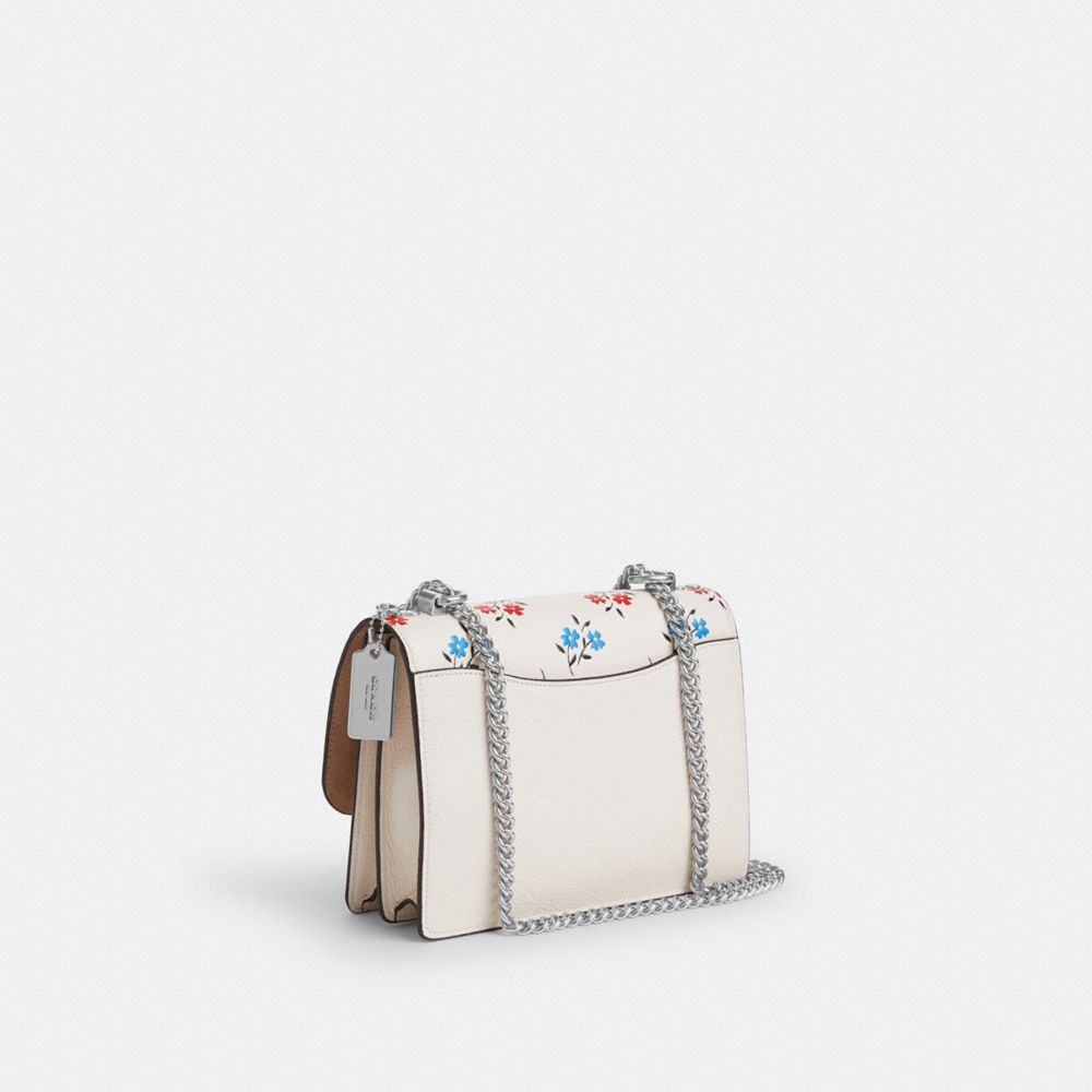 COACH®,Klare Crossbody Bag With Floral Print,Leather,Crossbody,Chain Detail,Logo,Metal,Silver Metal,Day Party,White,Angle View