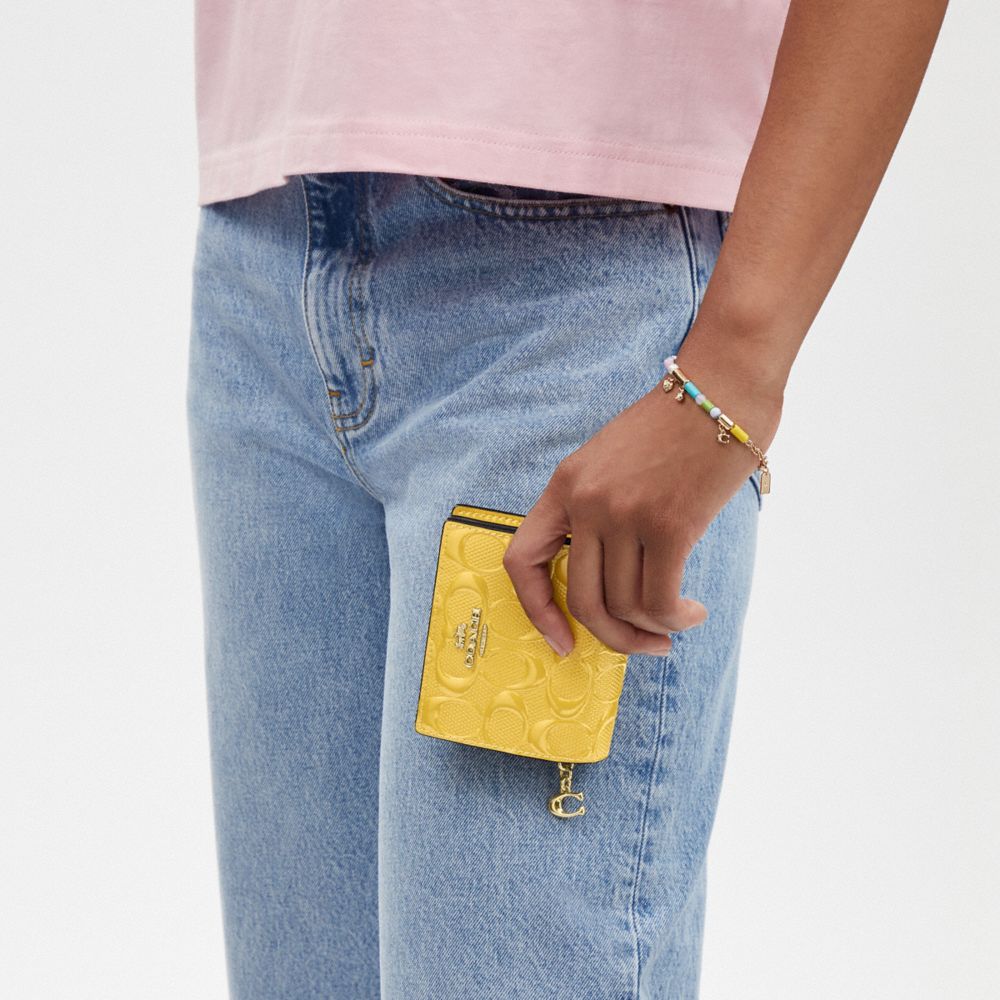COACH®,Snap Wallet In Signature Leather,Bi Fold,Coin,Casual,Mustard,Detail View
