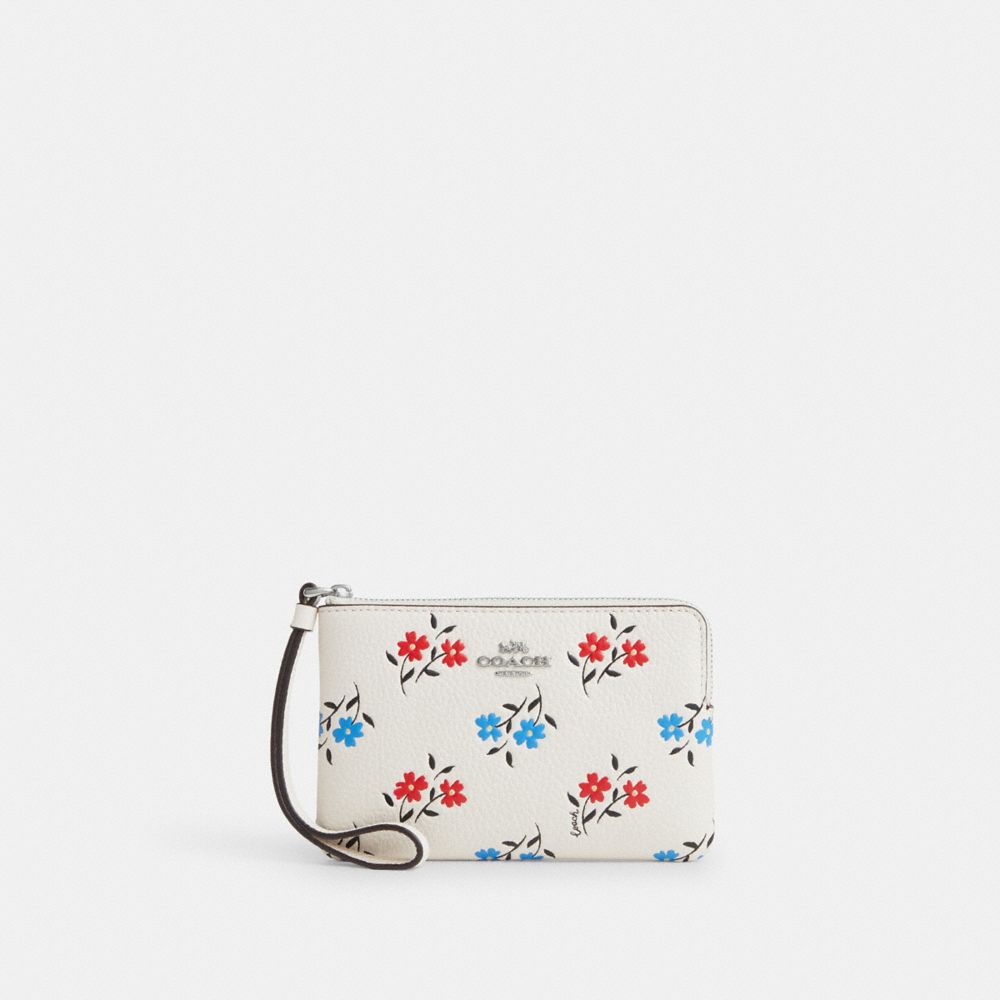 COACH®,WRISTLET À FERMETURE ZIPPÉE D’ANGLE AVEC MOTIF FLEURI,Cuir innovant,Argent/Craie multi,Front View