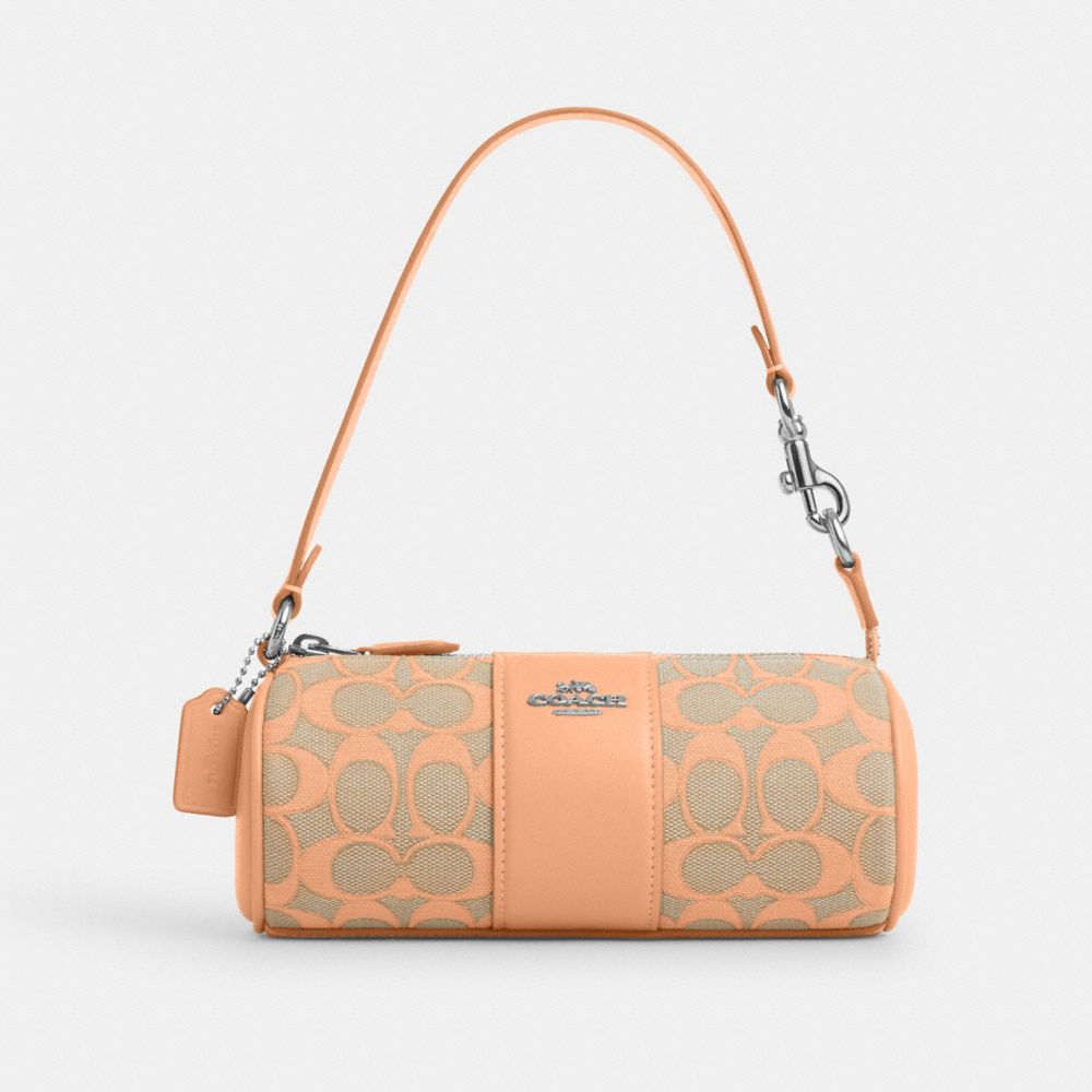 COACH®,NOLITA BARREL BAG IN SIGNATURE JACQUARD,Sv/Faded Blush,Front View