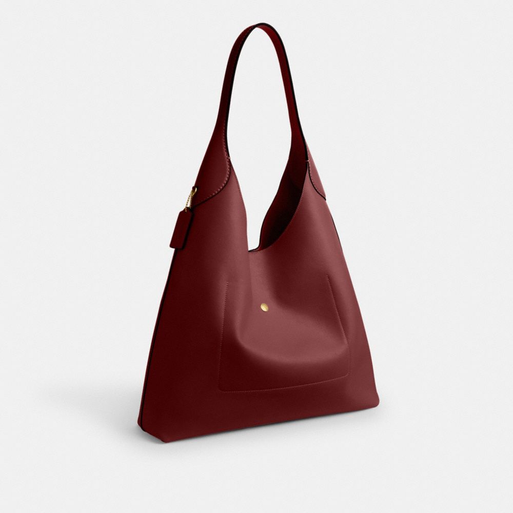 Coach In Brass/dark Ruby