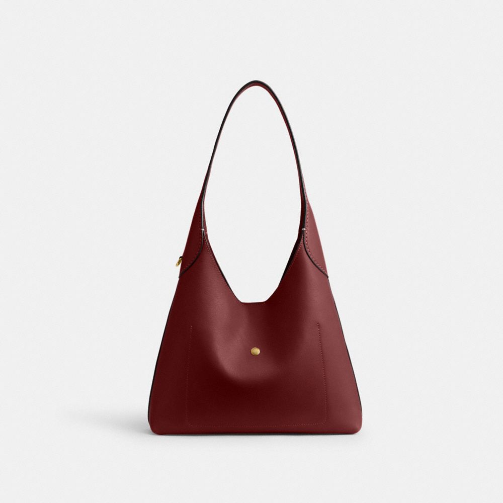 Coach In Brass/dark Ruby