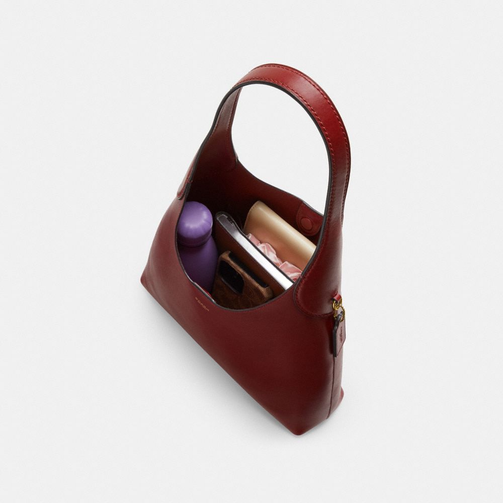 Coach In Brass/dark Ruby