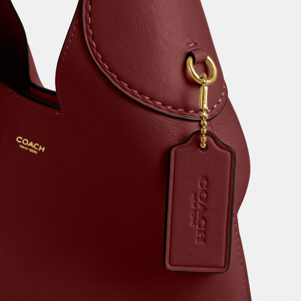Coach In Brass/dark Ruby