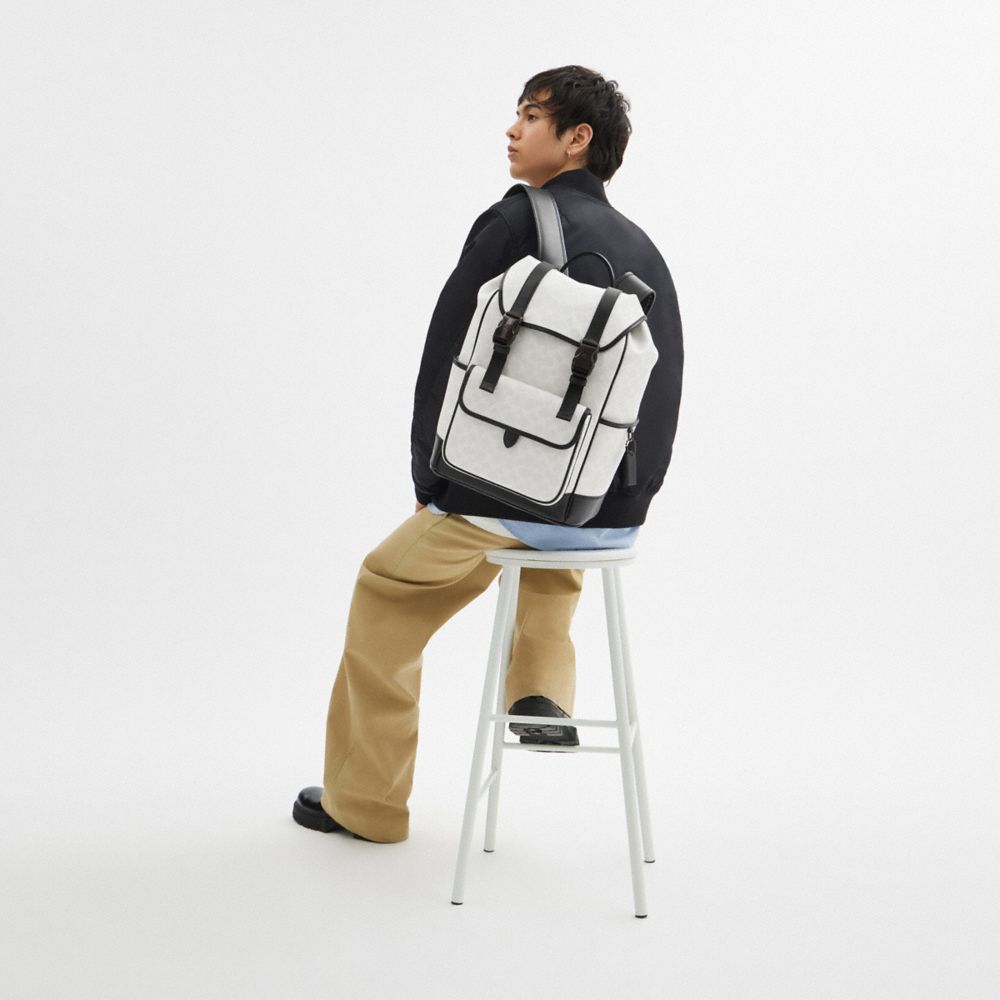 Coach League Flap Backpack In Signature Canvas