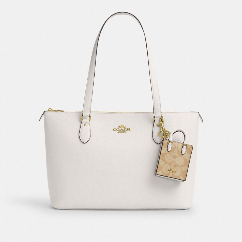 COACH®,North/South Mini Tote Bag Charm In Signature Canvas,Leather,Bag Charm,3D Embellishment,Key Ring,Beige,Angle View