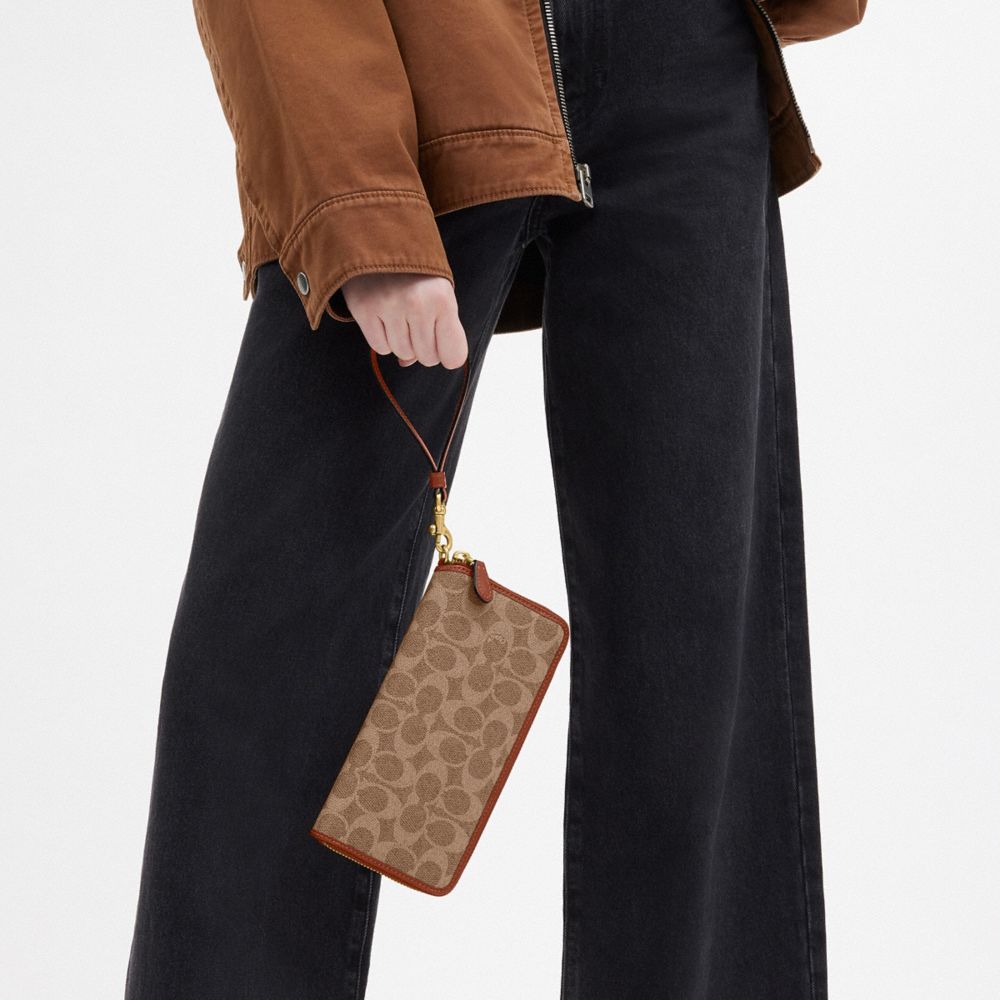 COACH®,Essential Continental Wallet In Signature Canvas,Calfskin Leather,Canvas,Leather,Wristlet,Continental,Piping,Logo,C...,Brown,Detail View