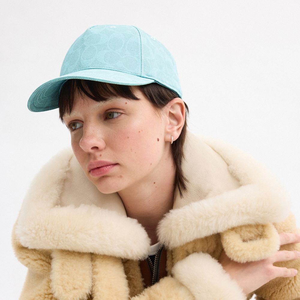 COACH®,SIGNATURE SUN BLEACHED BASEBALL HAT,Turquoise,Angle View