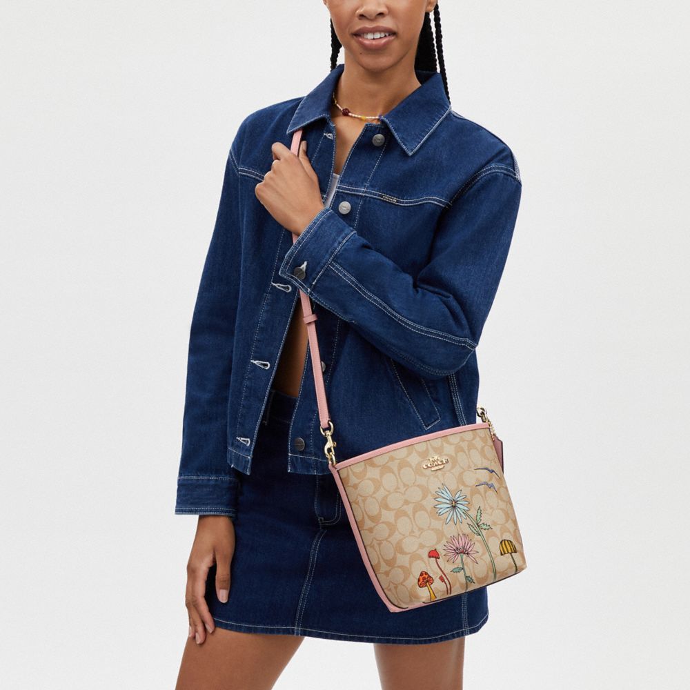 COACH®,Coach X Observed By Us City Bucket Bag In Signature Canvas,Bucket,Piping,Casual,Beige,Detail View