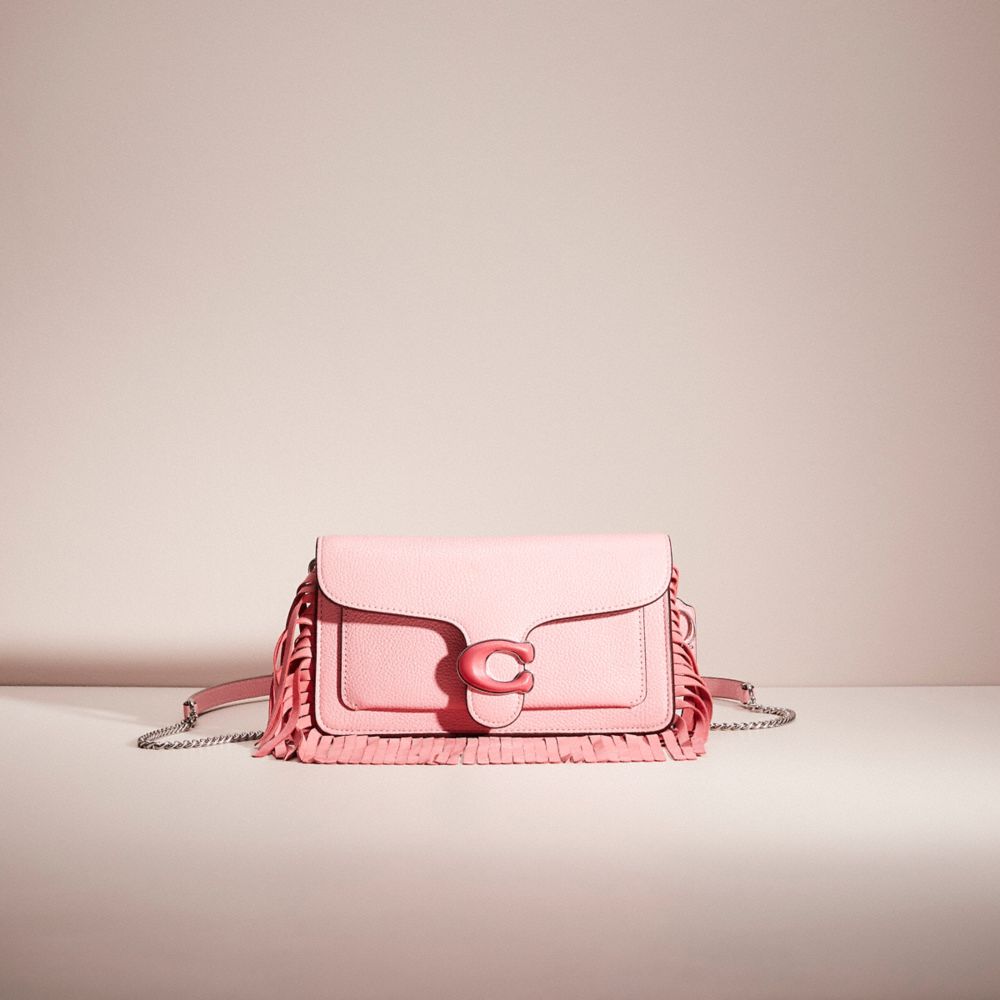 Coach pink online clutch