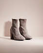 COACH®,RESTORED GIANA STRETCH BOOTIE,Suede,Heather Grey,Angle View