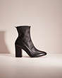 COACH®,RESTORED GIANA STRETCH BOOTIE,Leather,Black,Front View