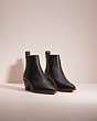 COACH®,RESTORED MELODY BOOTIE,Leather,Black,Angle View