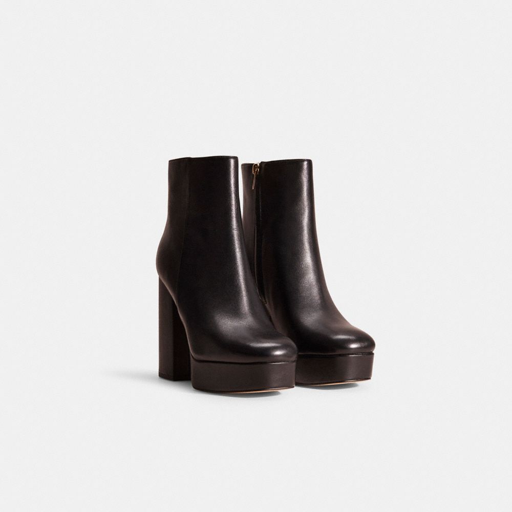 COACH®,Restored Iona Bootie,Rubber,Leather,Bootie,Metal,Logo,Pull Tab,Sustainable,Day Party,Black,Angle View