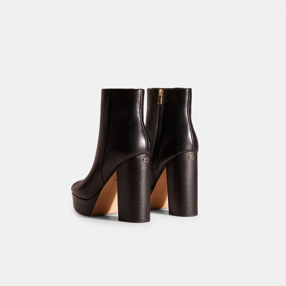 COACH®,Restored Iona Bootie,Rubber,Leather,Bootie,Metal,Logo,Pull Tab,Sustainable,Day Party,Black,Back View