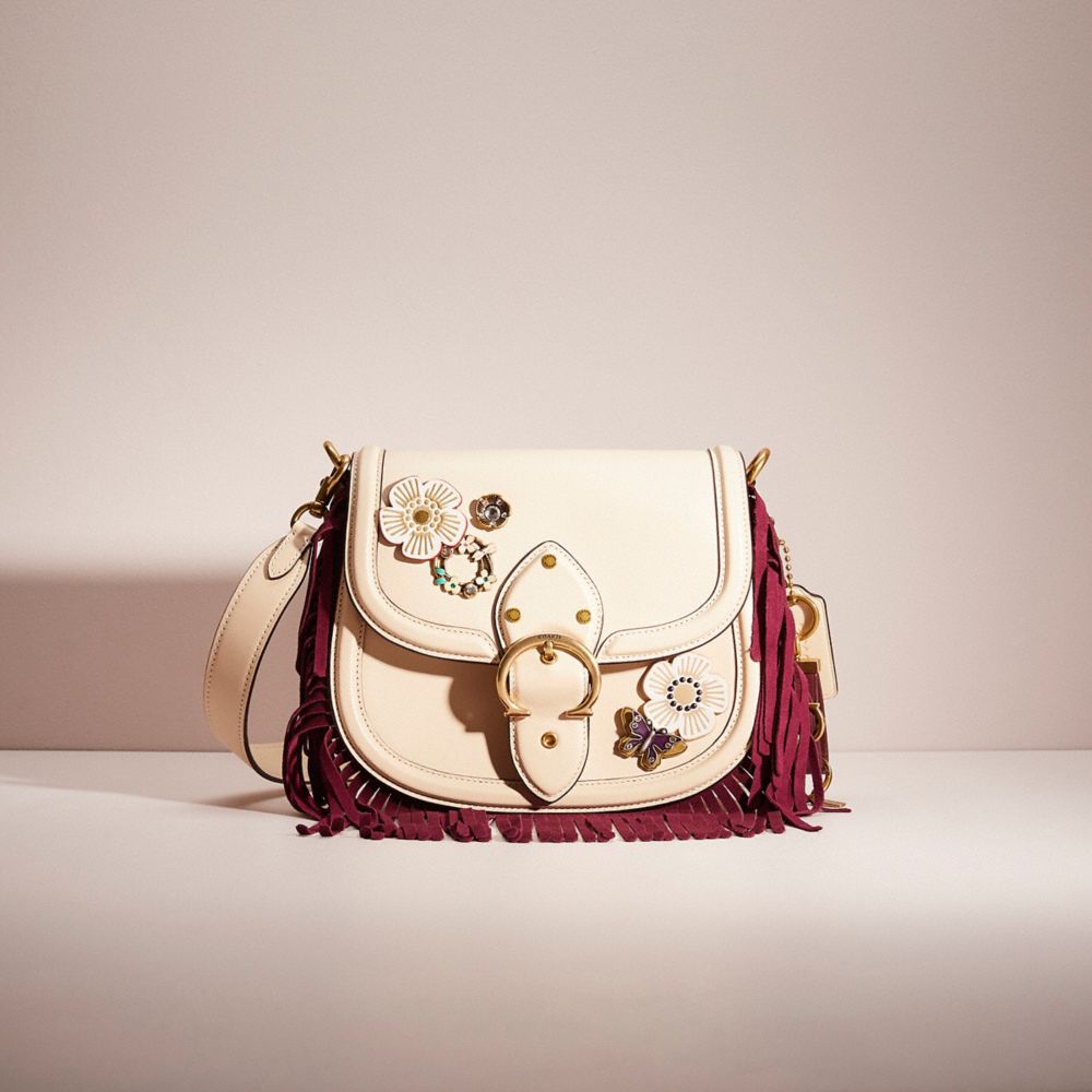 Coach tea rose saddle on sale bag