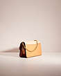 COACH®,UPCRAFTED BEAT CROSSBODY CLUTCH IN COLORBLOCK,Holiday Glow Up,Brass/Blush Natural Multi,Angle View
