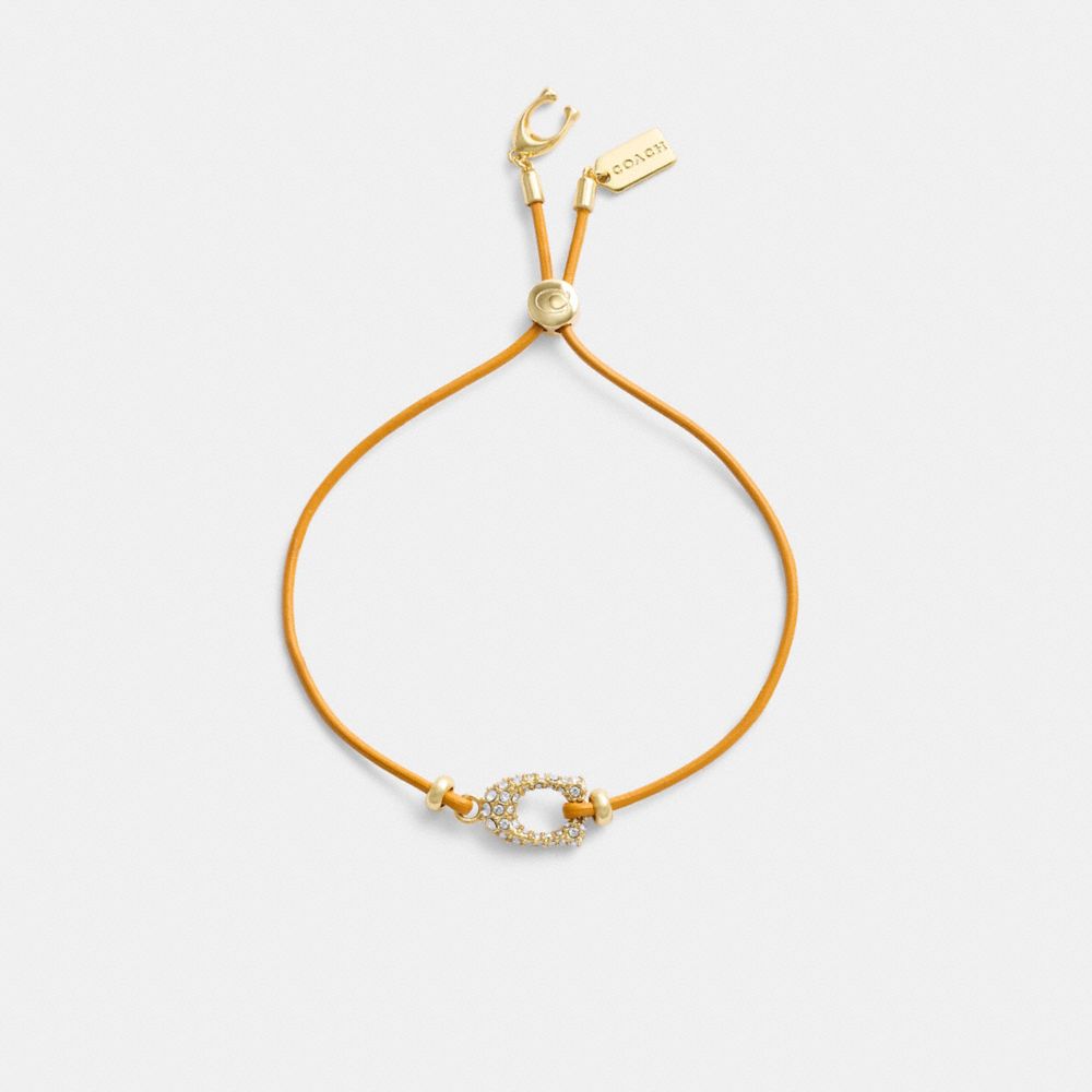 COACH®,Pavé Signature Leather Slider Bracelet,Leather,Cubic Zirconia,Glass,Gem Embellishment,Logo,Lettering Word,Gold Meta...,Orange,Inside View,Top View